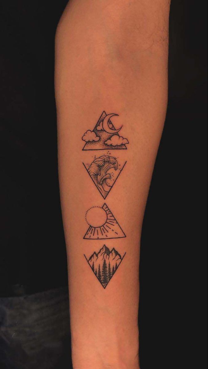 a tattoo on the leg of a person with mountains and trees in it, which is also