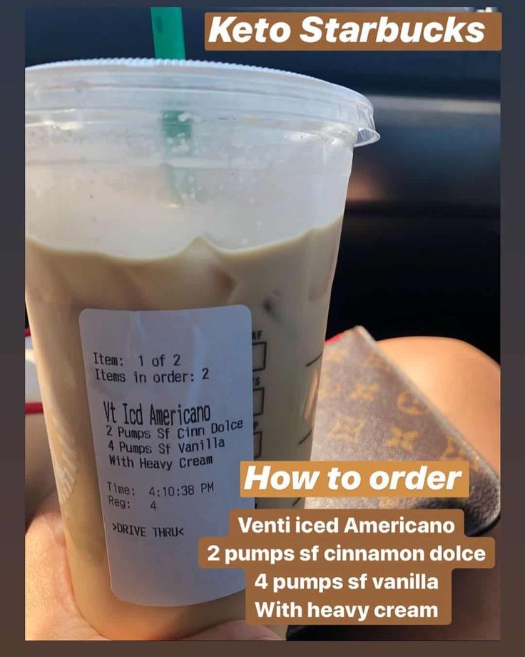 a person holding a plastic cup filled with ice cream and keto starbucks's how to order