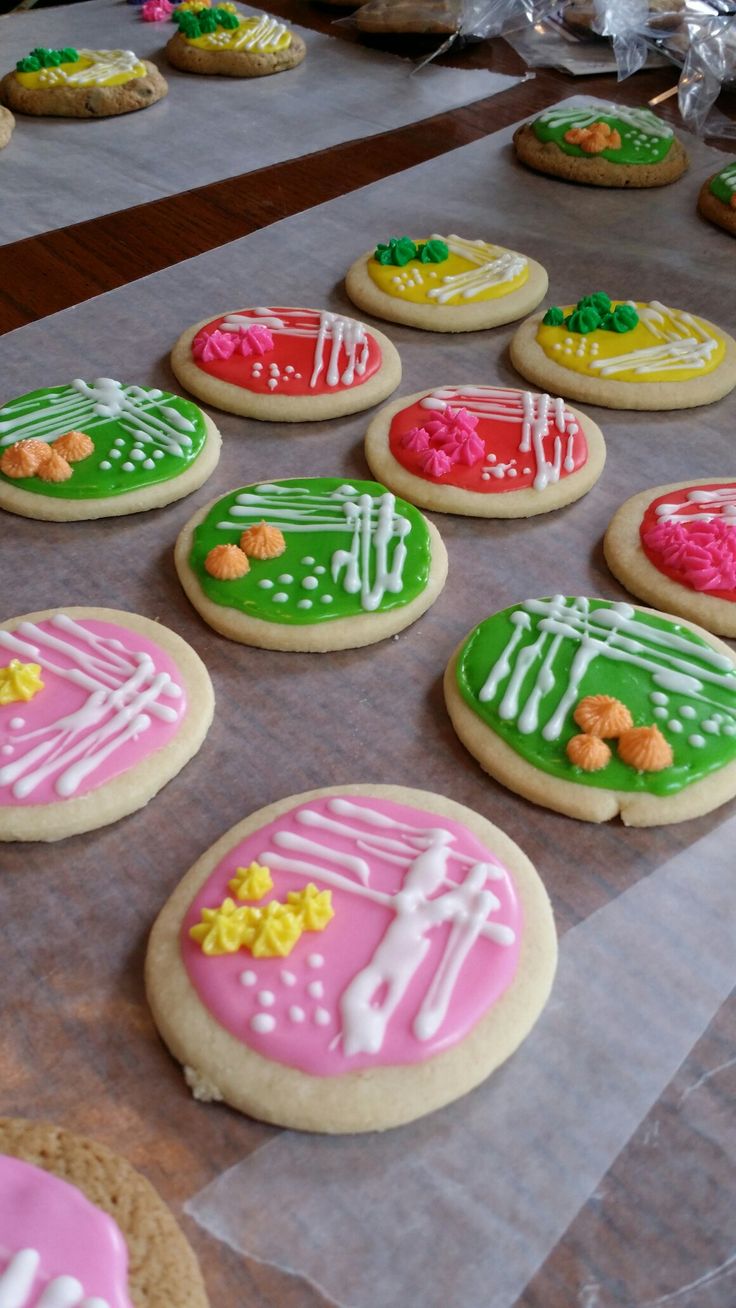 many decorated cookies sitting on top of a table