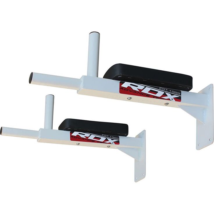 two white wall mounted brackets with red and black letters on the sides, one is attached to