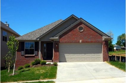 a red brick house with two car garages