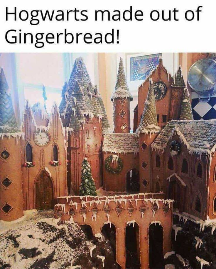 an elaborate gingerbread castle with snow on the ground