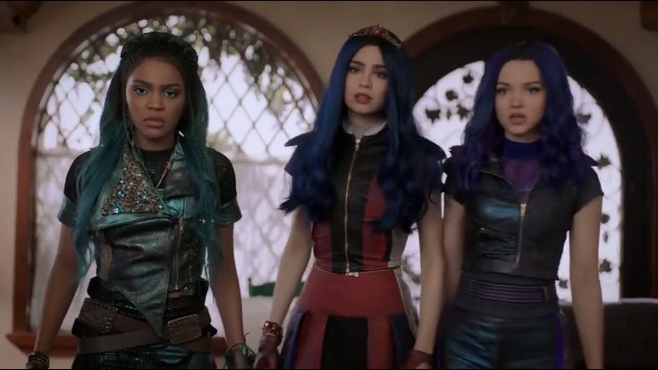 three women with blue hair standing next to each other