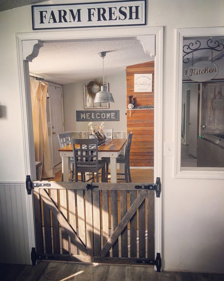 an open door leading to a kitchen and dining room