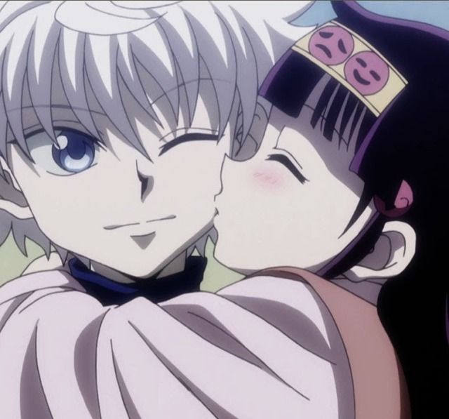 two anime characters are hugging each other