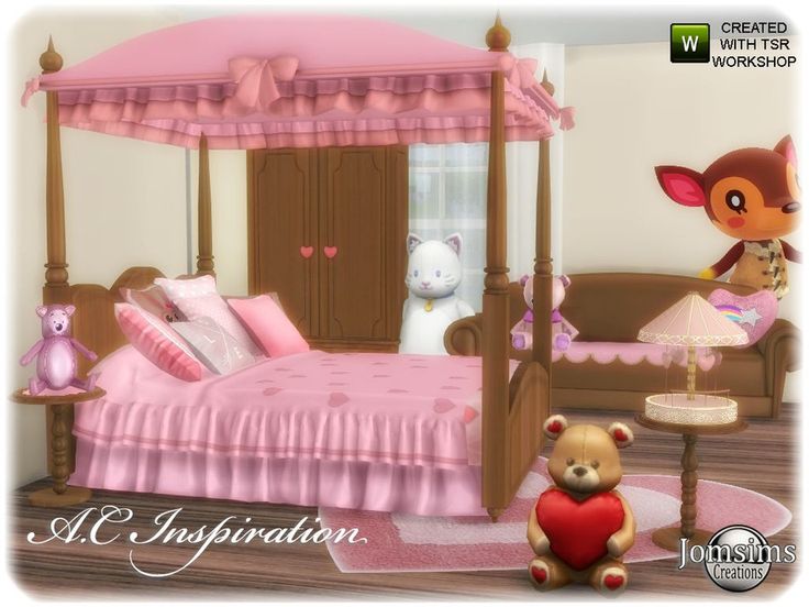 a teddy bear sitting in front of a pink bed