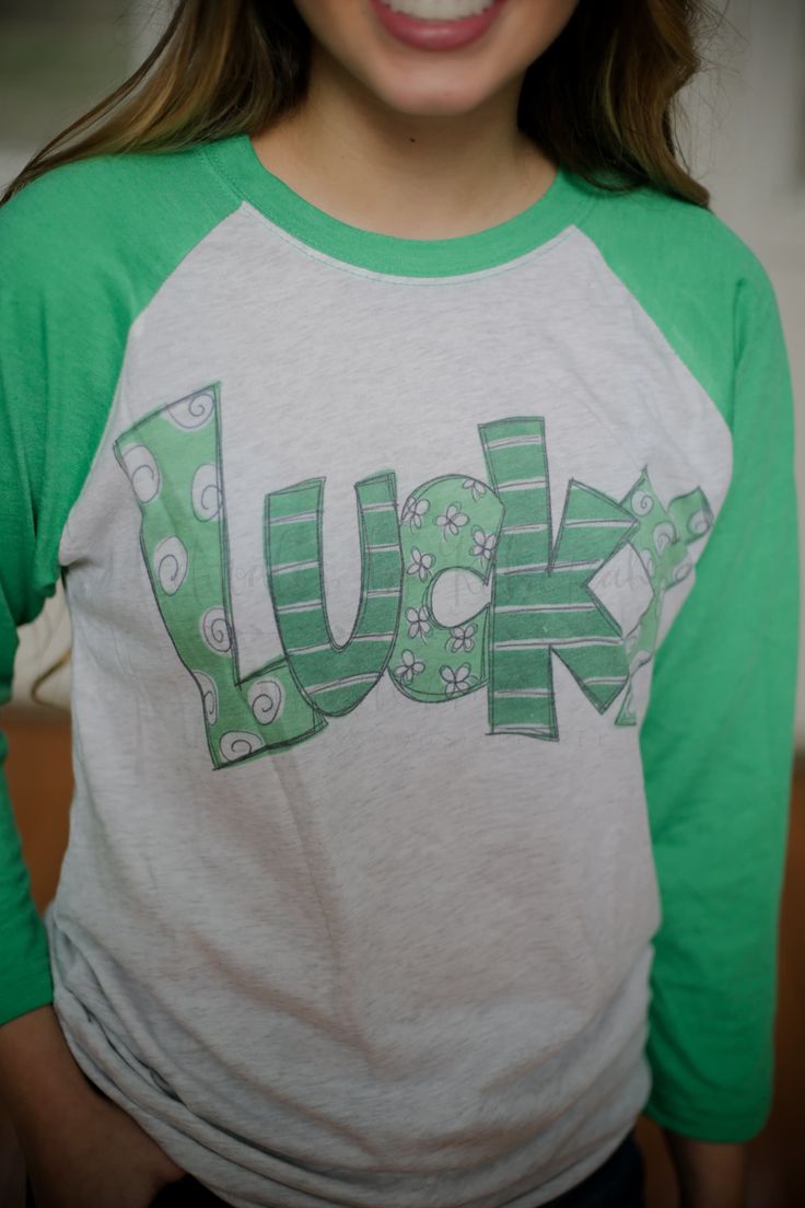 Lucky Raglan - Tees Fun Long Sleeve T-shirt With Screen Print, Trendy Long Sleeve T-shirt With Lettering, Trendy Custom Print Tri-blend T-shirt, Cute Unisex Long Sleeve T-shirt, Funny Green Tops With Letter Print, Cute Green Top With Text Print, Funny Green Top With Letter Print, Fun Green Tops With Letter Print, Cute Green T-shirt With Custom Print