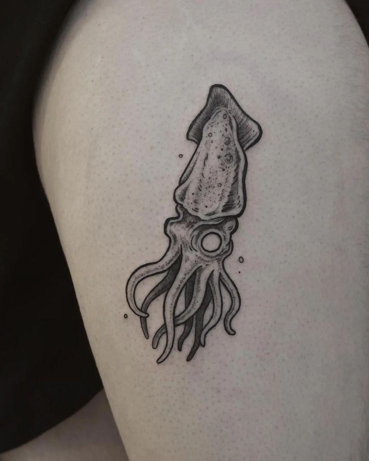 an octopus tattoo on the thigh