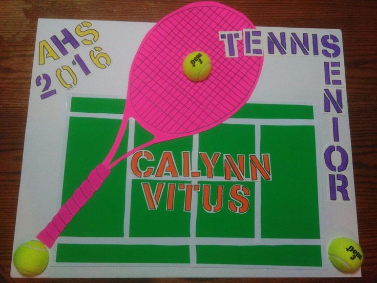 a tennis racket and ball on top of a table with the names of two tennis players