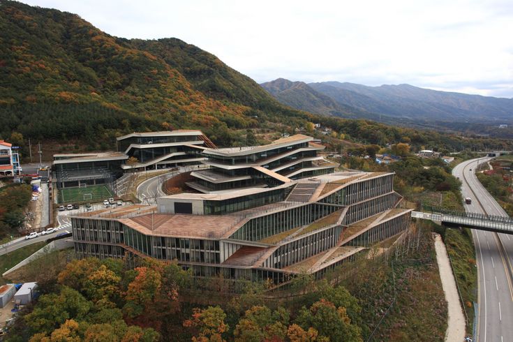 an aerial view of a building in the mountains