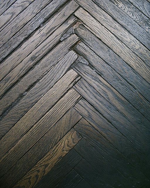 an image of wood flooring that looks like herringbones or chevron boards