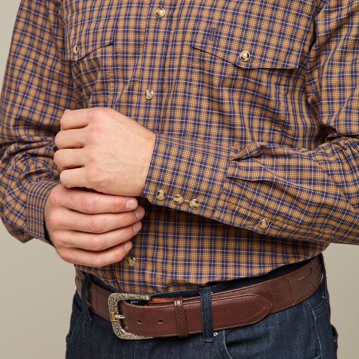 Named for our El Paso factory, this rugged, cotton western shirt features a cowboy yoke in front and back with a subtle, embroidered mirrored-L emblem on the left pocket and lower placket. Classic cowboy fit. Model is 6'0 and wearing size M. Brown Western Style Shirt For Fall, Western Style Brown Tops For Ranch, Brown Western Shirt For Fall, Western Style Shirt With Buttons For Rodeo, Western Style Workwear Shirt For Fall, Western Style Shirt For Rodeo, Classic Shirt With Pockets For Rodeo, Western Style Shirt With Button Closure For Fall, Western Style Workwear Tops With Pockets