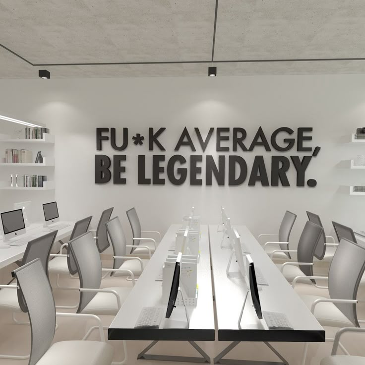 an empty conference room with white chairs and black letters on the wall that says fu - k average, be legendary