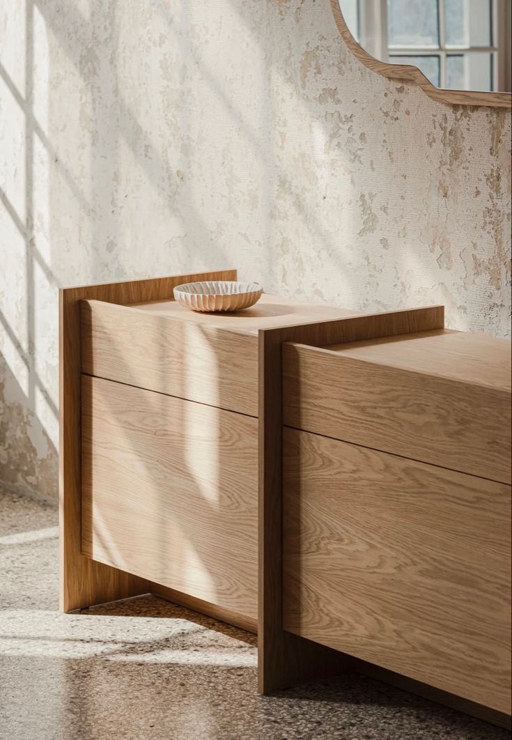 a wooden dresser sitting in front of a window