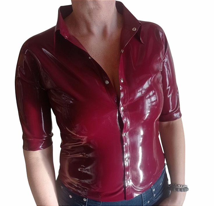 Latex blouse with a collar, fastened with snaps at the front. This item is made to order. After placing the order, please provide the dimensions in the comments: bust, waist, hips and arm circumference. If you have any questions, please contact us. - Made in Poland - Latex made in Poland - Handmade product. LATEX CARE: - Be careful with sharp objects, including jewelry or nails. - Do not use oil-based lubricants, including body moisturizers. - After use, wash in mild soapy water and then rinse w Stretch Short Sleeve Blouse With Buttons, Short Sleeve Stretch Blouse With Buttons, Stretch Short Sleeve Blouse With Button Closure, Collared Stretch Top With Button Closure, Fitted Padded Button-up Blouse, Stretch Collared Blouse With Buttons, Fitted Button-up Shirt With Padded Blouse, Fitted Collared Shirt With Buttons, Fitted Fall Shirt With Collared Neckline