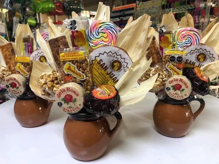 three brown vases filled with candy and candies