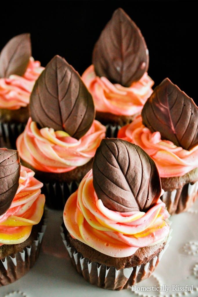 cupcakes with frosting and chocolate leaves on top