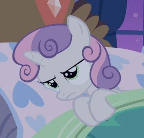 the pinkie is laying in bed with her eyes closed and looking at something off to the side