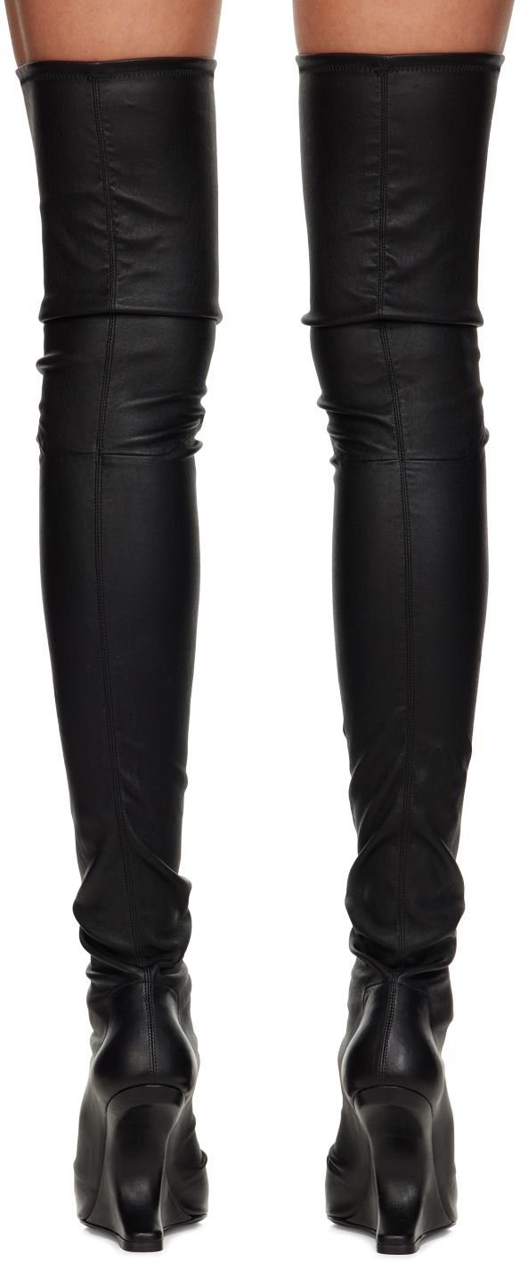 Thigh-high stretch grained lambskin boots in black. · Open square toe · Padded calfskin footbed · Goatskin lining · Covered modified wedge heel · Leather sole with rubber injection · Heel: H4.5 in Supplier color: Black Leather Thigh High Boots With Wide Calf Fit, Wide Calf Thigh High Leather Heeled Boots, Modern Leather Thigh High Heeled Boots, Thigh High Leather Heeled Boots For Wide Calves, Modern Thigh High Leather Heeled Boots, Modern Thigh-high Leather Heeled Boots, Luxury Fitted Knee-high Boots With Square Toe, Luxury Fitted Square Toe Knee-high Boots, Black Leather Over-the-knee Platform Boots