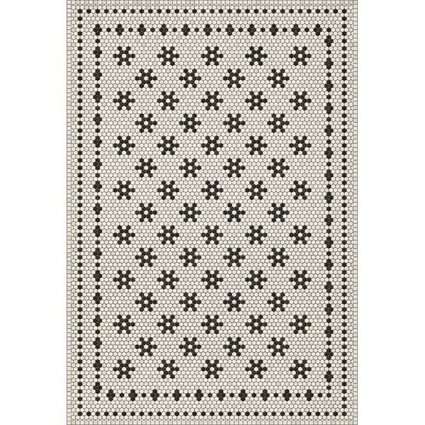 a black and white rug with crosses on it