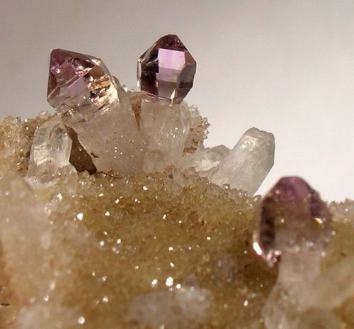 some very pretty pink and purple crystals together