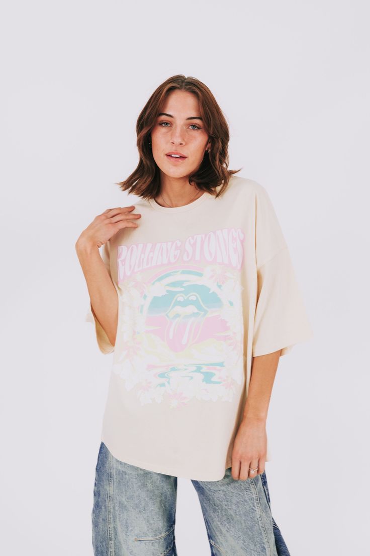 Add some groovy vibes to your wardrobe with this Rolling Stones tee! Featuring an iconic graphic and an oversized fit, this tee is perfect for music lovers and fashionistas alike. Don't miss out on this must-have piece for your collection. Details Rolling Stones graphic Oversized fit Sizing Approximate measurements: SIZE LENGTH BUST Small 29" 50" Medium 29" 52" Large 30" 54" Fabric has stretchModel is 5’8 wearing small Material 100% CottonWash with similar colorsHang dry Groovy Tees, Rolling Stones Tee, Groovy Vibes, Rolling Stones, Music Lovers, Must Haves, Rolls, Wardrobe, Stone