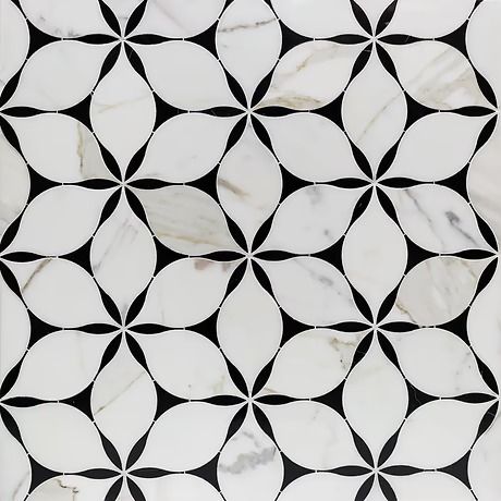 a white marble tile with black and white circles in the center, on top of it