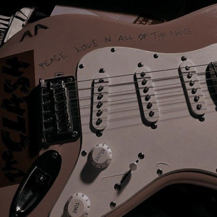 an electric guitar with some writing on it