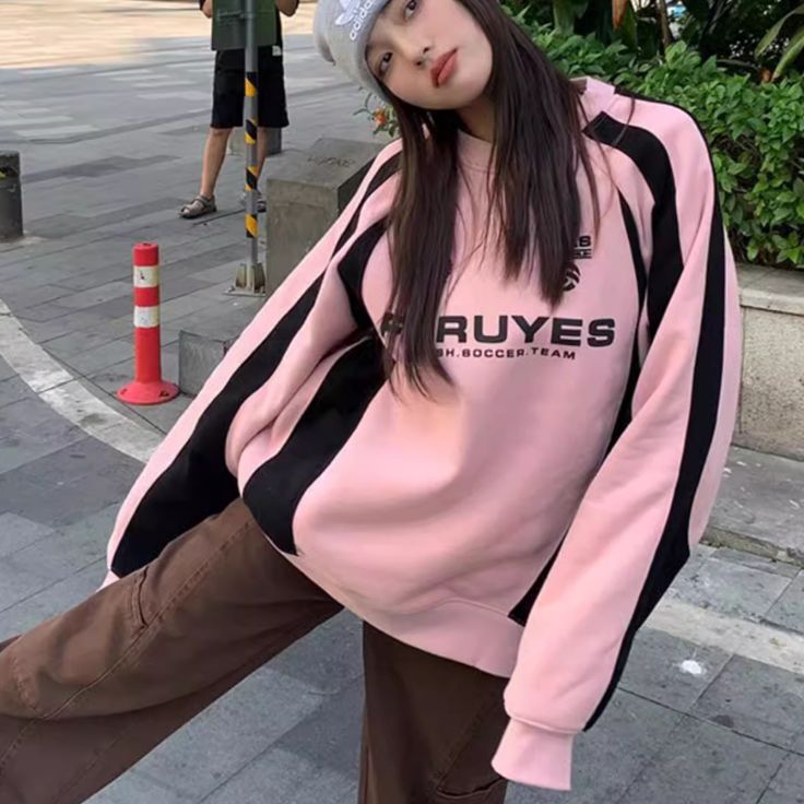 Wrap yourself in luxury with our Pink Letter Sweatshirt. Featuring a sophisticated patchwork design, this sweatshirt adds an elevated touch to your outfit. The soft pink letters add a subtle pop of color, making it perfect for any occasion. Elevate your style and comfort with our exclusive sweatshirt. Features: -15% Cotton,85% Polyester -Crew Neck -Letter -Super Soft Fabric -Regular fit -Classic style Pink Letter Print Sweater For Winter, Varsity Color Block Long Sleeve Sweatshirt, Spring Crew Neck Sweatshirt With Contrast Color, Pink Casual Sweater For College, Casual Pink Sweater For College, Pink Long Sleeve Sweatshirt With Ribbed Cuffs, Sporty Pink Sweater With Ribbed Cuffs, Pink Spring College Sweatshirt, Pink Cotton Sweatshirt For College