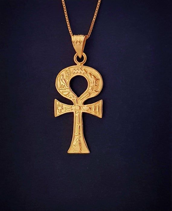 Gold Ankh Necklace, 14k Gold Vermeil Over Sterling Silver, Egyptian Revival Ankh Cross, Ankh Jewelry.The Egyptian ankh necklace carries a powerful message, literally meaning “the breath of life”. This Egyptian revival pendant is considered a key to life, as it offers you a powerful union. Bringing together feminine and masculine aspects that are contained in their form. Creating a never-ending circuit of energy, that helps ensure a boost in energy on a day to day basis.• Material: Our Ankh neckl Symbolic Necklaces With Intricate Design, Traditional 14k Gold Collectible Jewelry, Ceremonial 14k Gold Symbolic Necklace, Gold Cross Necklace For Ceremonial Occasion, Collectible Gold Necklaces With Cross Pendant, Traditional Cross Jewelry For Collectors, Ceremonial Symbolic 14k Gold Necklace, Symbolic 14k Gold Ceremonial Necklace, Traditional Cross Pendant For Ceremonial Occasions