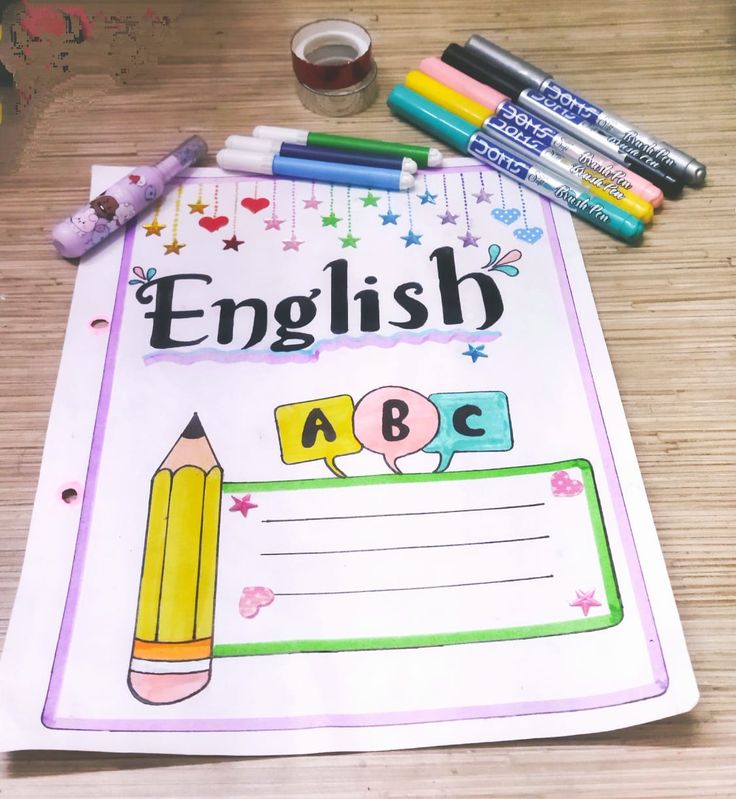 an english notebook with pencils and markers