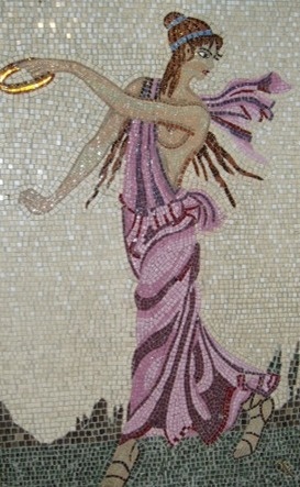 a mosaic depicting a woman holding a frisbee in her right hand and wearing a pink dress