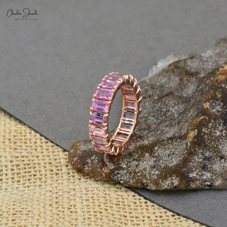 Pink Sapphire Eternity Ring Band Pink Fine Jewelry Eternity Band For Promise, Pink Eternity Band Fine Jewelry, Pink Eternity Band Promise Ring Fine Jewelry, Fine Jewelry Pink Eternity Band With Gemstone, Pink Sapphire Stackable Ring In Fine Jewelry Style, Pink Gemstone Eternity Band Fine Jewelry, Pink Sapphire Stackable Ring For Anniversary, Pink Cubic Zirconia Half Eternity Rings, Pink Eternity Band With Prong Setting As Promise Ring