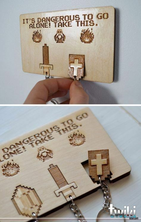 a wooden keychain that has been made to look like an old game card