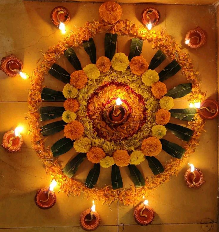 an overhead view of candles and flowers in the center