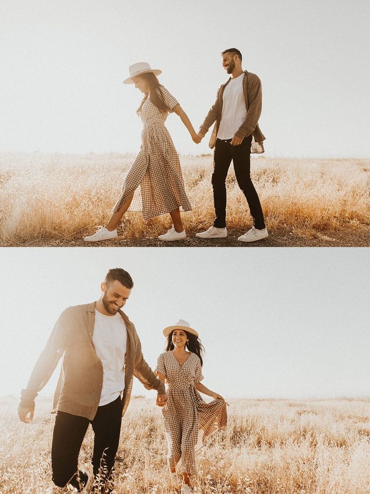 two people holding hands and walking through tall grass