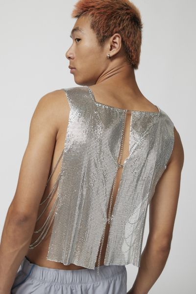 Troye metal tank top in a sleeveless style with an open back and cropped fit. Content + Care Mixed metals Wipe clean Imported Size + Fit S/M Dimensions Chest: 26" + 6" extender Length: 22" L/XL Dimensions Chest: 30.5" + 6" extender Length: 22.5" | Troye Metal Tank Top in Silver, Men's at Urban Outfitters Fitted Silver Sleeveless Crop Top, Silver Sleeveless Crop Top For Evening, Summer Evening Tank Crop Top, Silver Sleeveless Crop Top For Night Out, Metallic Crop Top For Summer Evenings, Metallic Crop Top For Evening In Summer, Metallic Sleeveless Crop Top For Evening, Urban Outfitters Tank Top For Summer Nights Out, Urban Outfitters Tank Top For Night Out In Summer