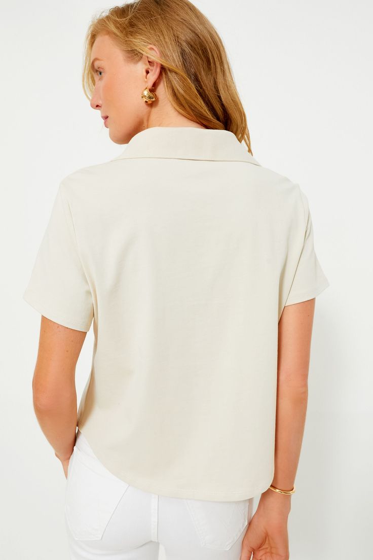 The Tan Isla Tee will be an easy style staple in your closet. This effortless top features a spread collar with a V-neckline and a boxy fit. With a slightly cropped hem this piece would go perfectly with some jeans shorts and gold jewelry or tucked into white pants with a blue sweater thrown over your shoulders. V-neckline Spread collar Short sleeves Front placket Rounded hem Boxy fit Material: 100% Cotton (body), 95% Cotton, 5% Spandex (trim) Care: Hand wash cold, hang to dry Hamptons Summer, Easy Style, Plus And Minus, Cocktail Attire, Color Crush, Blue Sweater, Weekend Wear, White Pants, Pullover Sweatshirts