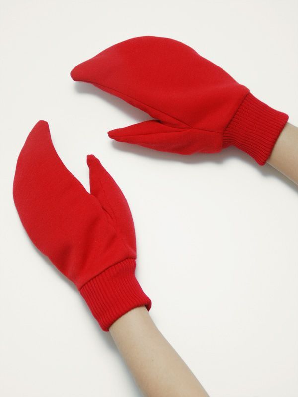 a pair of red gloves on top of a white table