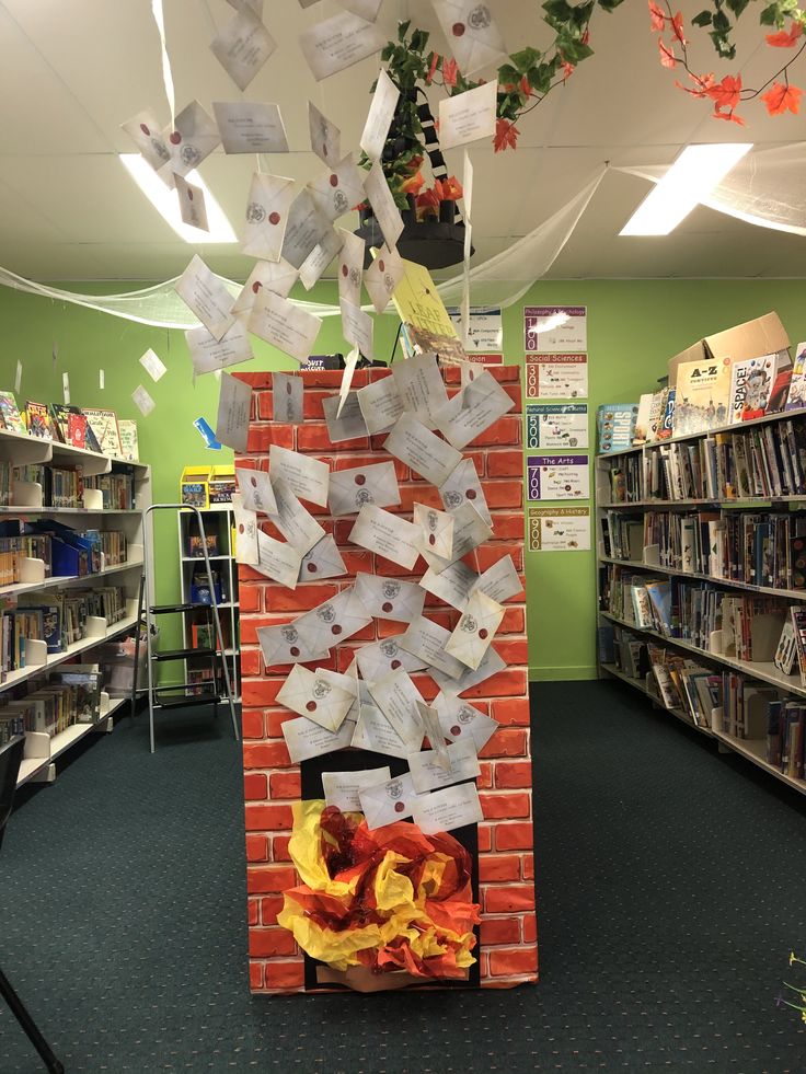 a fire place in the middle of a library with lots of papers stuck to it