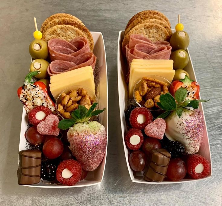 two trays filled with different types of food