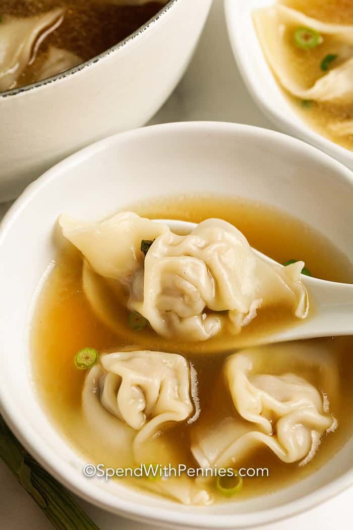 soup with dumplings in a white bowl on a table