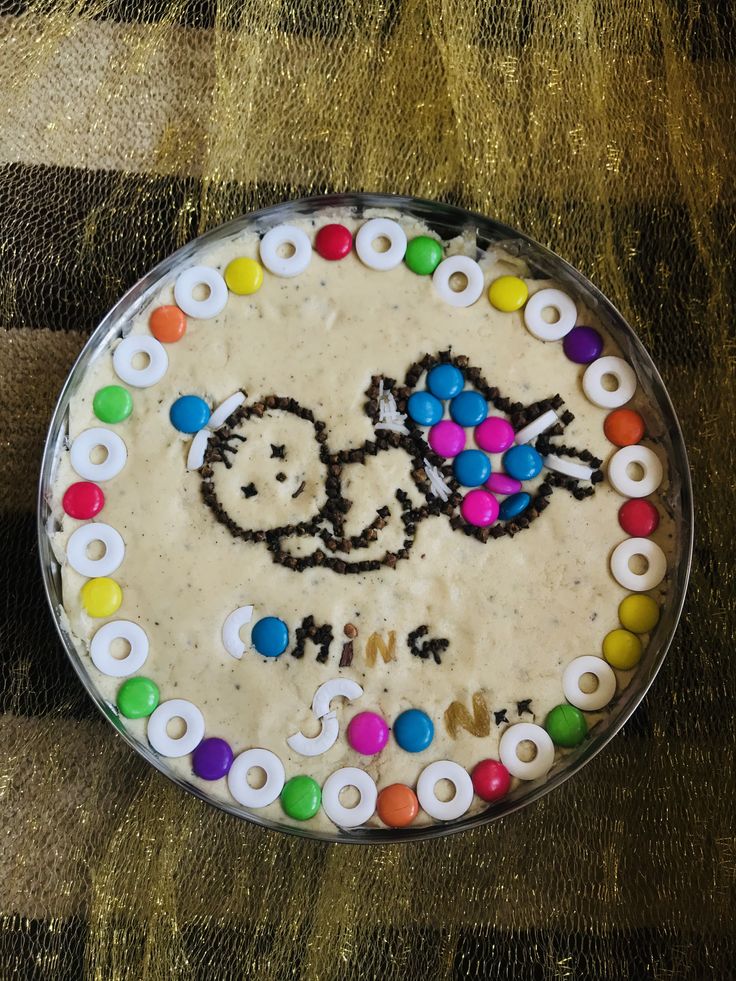 a birthday cake decorated with an image of a bicycle on the frosting and sprinkles