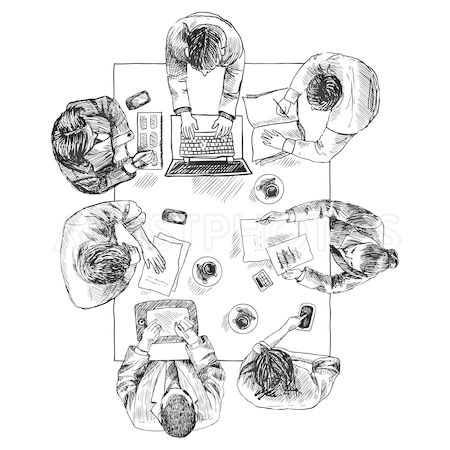 people sitting at a table with laptops and papers on it, top view from above