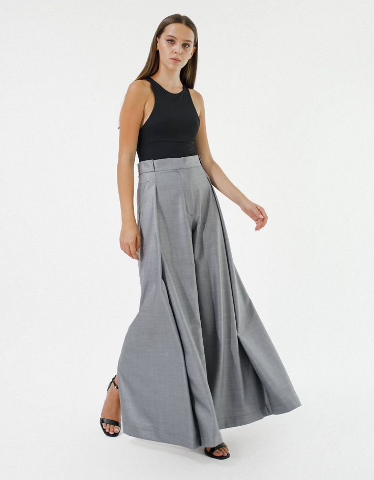 High-waisted wide-leg pants IPANTS. Pants have side pockets, hidden zip, and hook-and-eye closure on the middle. On the backside, the palazzo has wide slits that create a significant effect while walking.Composition:Gray: 70% wool, 28% viscose, 2% elastanePink: 40% viscose, 40% polyester, 20% elastaneSize chart:Size XSwaist - around 26''/ 66 cmhips - around 37''/ 94 cmTotal length approx 43.3 ''/ 110 cmSize Swaist - around 27.6''/ 70 cmhips- around 38.6''/ 98 cmTotal length approx 43.7''/ 111 cm Chic Wide Leg Maxi Skirt With Side Slits, Wide Leg Pants With Side Slits For Spring, Chic Wide Leg Pants With Side Slits For Spring, Formal Wide Leg Pants With Belt Loops, Wide Leg Evening Bottoms With Belt Loops, Spring Wide-leg Pants With Side Slits, Wide Leg Pants With Loosely Fitted Hips, Fitted Wide Leg Pants With Pockets, Elegant Wide Leg Culottes With Pockets