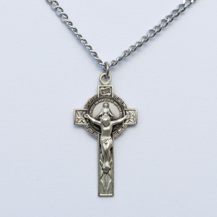 In 1820, Mary appeared to St. Catherine and said, "Have a medal struck upon this model. Those who wear it will receive great graces, especially if they wear it around the neck". Wear this sacred item close to your heart as a timeless reminder and a personal connection to her immaculate heart. Details:  * Dimensions: 1.6" x 0.9" (41mm x 21mm) * Weight of medal: 4.5 Grams. Comes with a 13", 16", 18", 20", or 24" chain. Personal Connection, Crucifix Necklace, Immaculate Heart, St Catherine, Miraculous Medal, Halloween Shopping, Necklace Etsy, Beauty Book, Accessory Gift