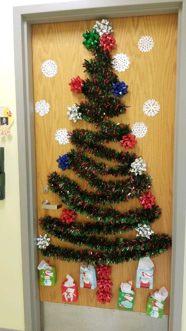 a christmas tree made out of tinsel wrapped presents