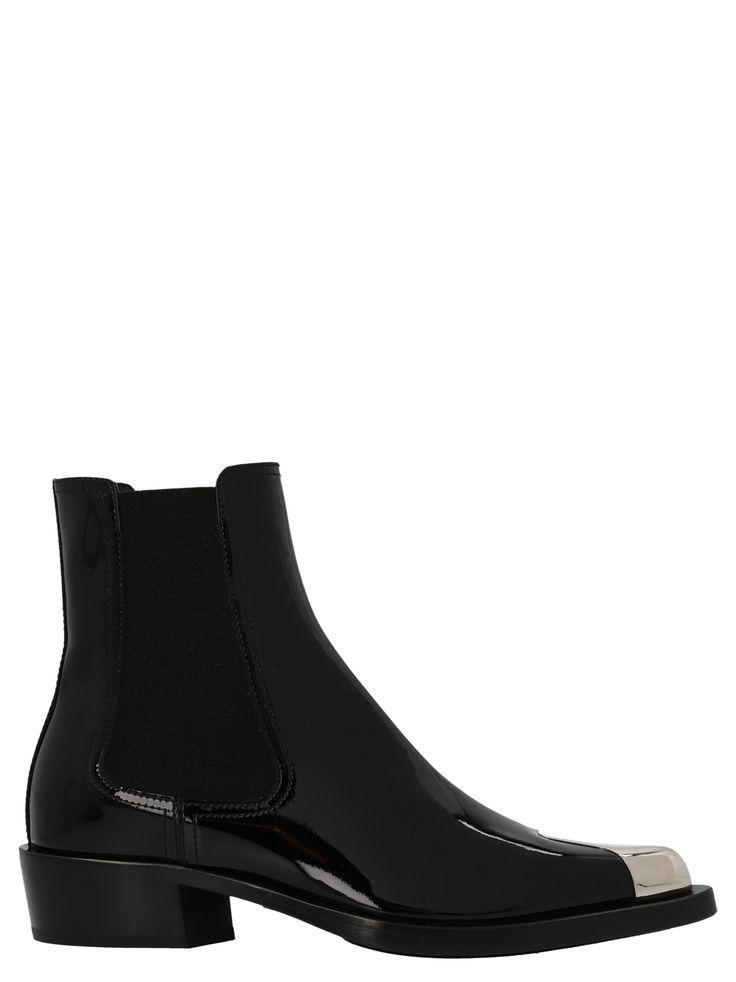 Patent leather ankle boots with side elastic, pointed model with metal detail. Composition: | Alexander McQueen Women's Patent Ankle Boots in Black | FW22/23 Alexander Mcqueen Boots, Metal Detail, Black Patent Leather, Black Ankle Boots, Luxury Retail, Leather Ankle Boots, Luxury Boutique, Rubber Rain Boots, Women Collection