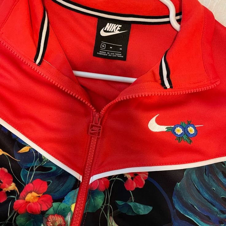 Brand New Nike Crop Jacket Size Medium Red Floral Print Winter Outerwear, Winter Red Floral Print Outerwear, Nike Long Sleeve Track Jacket For Spring, Nike Spring Long Sleeve Track Jacket, Red Nike Outerwear For Spring, Red Nike Casual Track Jacket, Nike Casual Track Jacket For Spring, Red Long Sleeve Track Jacket For Spring, Red Long Sleeve Spring Track Jacket