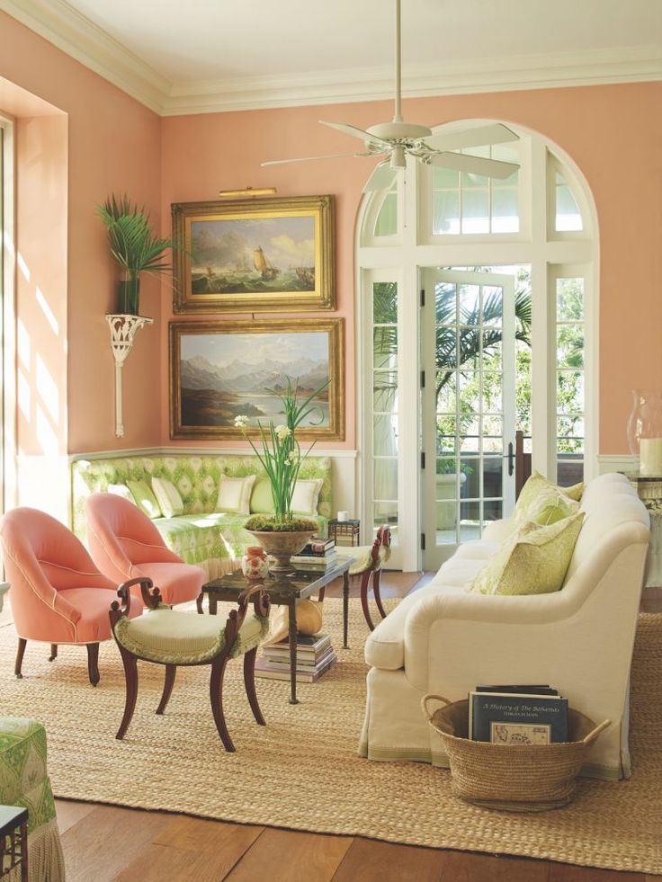 a living room filled with furniture and lots of windows